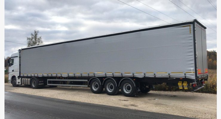 Полуприцеп шторно-бортовой Тонар Т-3-16 модель 98881 — общий вид сзади сбоку